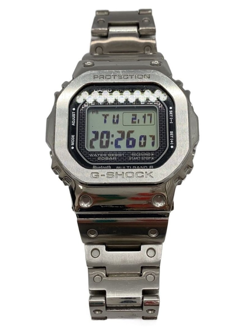 Casio G Shock GMW B5000D 1JF Silver Men's Wristwatch: Casio G Shock GMW B5000D 1JF Silver Men's Wristwatch This CASIO G-SHOCK GMW-B5000D-1JF men's wristwatch features a silver-tone design and is made in Japan. The watch shows slight signs of use and is i