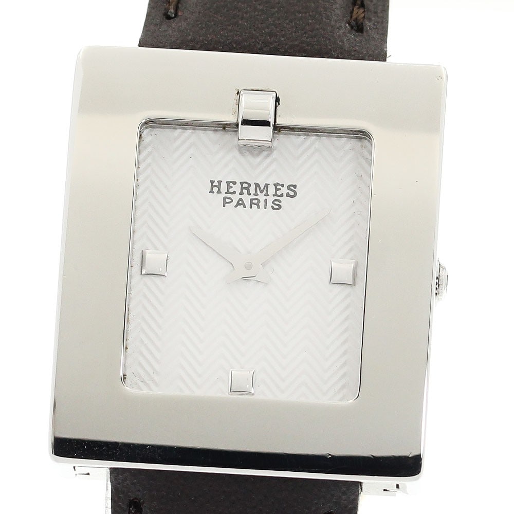Hermes BE1.210 women's quartz wristwatch leather band: Hermes BE1.210 women's quartz wristwatch leather band This Hermes BE1.210 women's wristwatch features a stainless steel case paired with a white dial and a leather band. The watch operates with a quar