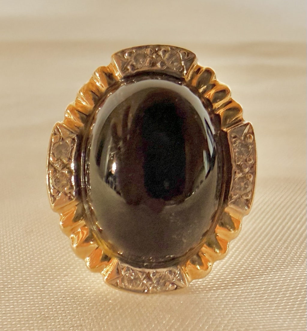 Diamond and Black Coral Ring in 14k Yellow Gold Size 5.5: Diamond and Black Coral Ring in 14k Yellow Gold Size 5.5 This is a 14k yellow gold ring featuring a black coral centerpiece accented by a diamond. The ring is size 5.5 and showcases detailed design an