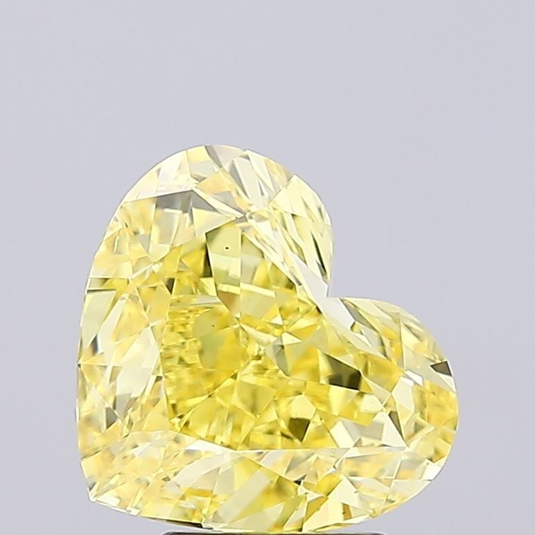 Loose Diamond - HEART 4.51ct Fancy Vivid Yellow VS2: Loose Diamond - HEART 4.51ct Fancy Vivid Yellow VS2 Source: This is a real non-mined Diamond that has been grown in a lab Shape: HEART Carats: 4.51 Color: Fancy Vivid Yellow Certification: IGI Video: