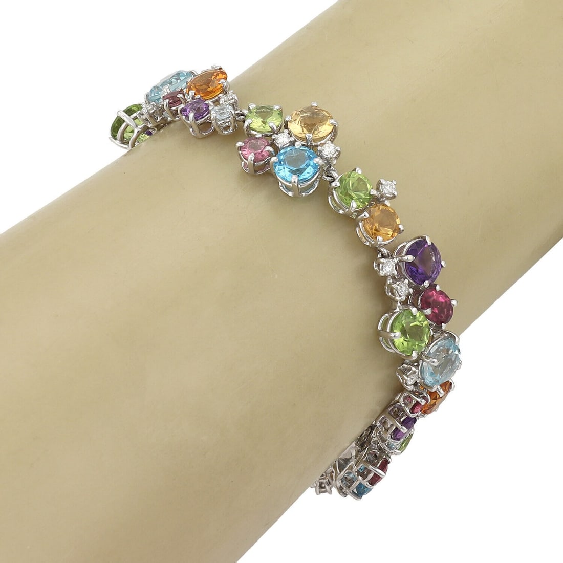 18k White Gold Link Bracelet with Diamonds and Multicolor Gems: 18k White Gold Link Bracelet with Diamonds and Multicolor Gems This vintage link bracelet is crafted from solid 18k white gold and features an elegant design adorned with a vibrant assortment of multi