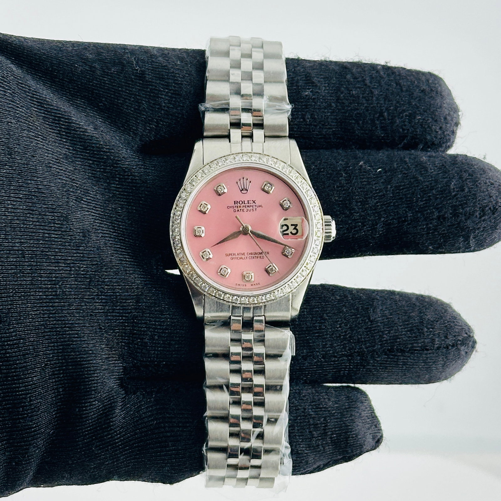 Ladies Rolex Datejust pink dial diamond markers Aftermarket Jubilee bracelet Ref 6466: Ladies Rolex Datejust pink dial diamond markers Aftermarket Jubilee bracelet Ref 6466 This ladies' Rolex Datejust features an aftermarket pink dial adorned with diamond markers, paired with an afterma