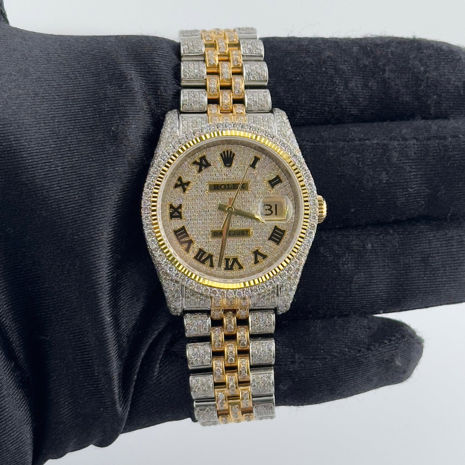 Rolex Datejust 116233 Mens Watch Diamond Prong Bezel Jubilee Iced Roman Dial Aftermarket: Rolex Datejust 116233 Mens Watch Diamond Prong Bezel Jubilee Iced Roman Dial Aftermarket This is a men's Rolex Datejust watch featuring an iced out Roman numeral dial and a Jubilee bracelet. The watch