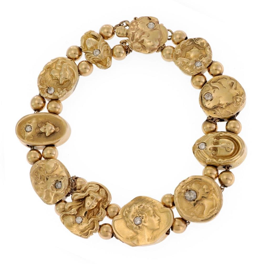 Art Nouveau 14k Yellow Gold Cameo Charm Bracelet with Diamonds: Art Nouveau 14k Yellow Gold Cameo Charm Bracelet with Diamonds This exquisite vintage Art Nouveau bracelet showcases the elegance of 14k yellow gold, adorned with a variety of hollow cameo charms each