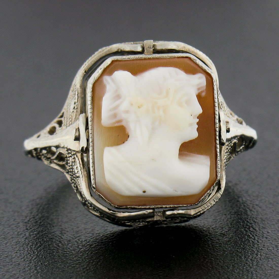 Antique Art Deco 14K Gold Filigree Flip Ring with Shell Cameo Amethyst and Diamond: Antique Art Deco 14K Gold Filigree Flip Ring with Shell Cameo Amethyst and Diamond This exquisite Art Deco flip ring is crafted from solid 14K white gold and features a beautifully carved shell cameo 