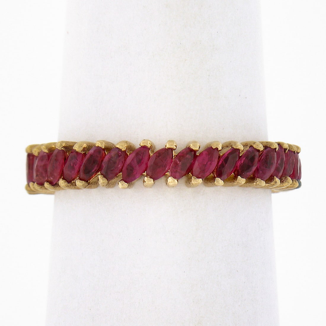 Vintage 14k Yellow Gold 3ctw Marquise Ruby Eternity Stackable Band Ring: Vintage 14k Yellow Gold 3ctw Marquise Ruby Eternity Stackable Band Ring This exquisite vintage band ring is crafted from solid 14k yellow gold and features a stunning eternity design adorned with 35 m