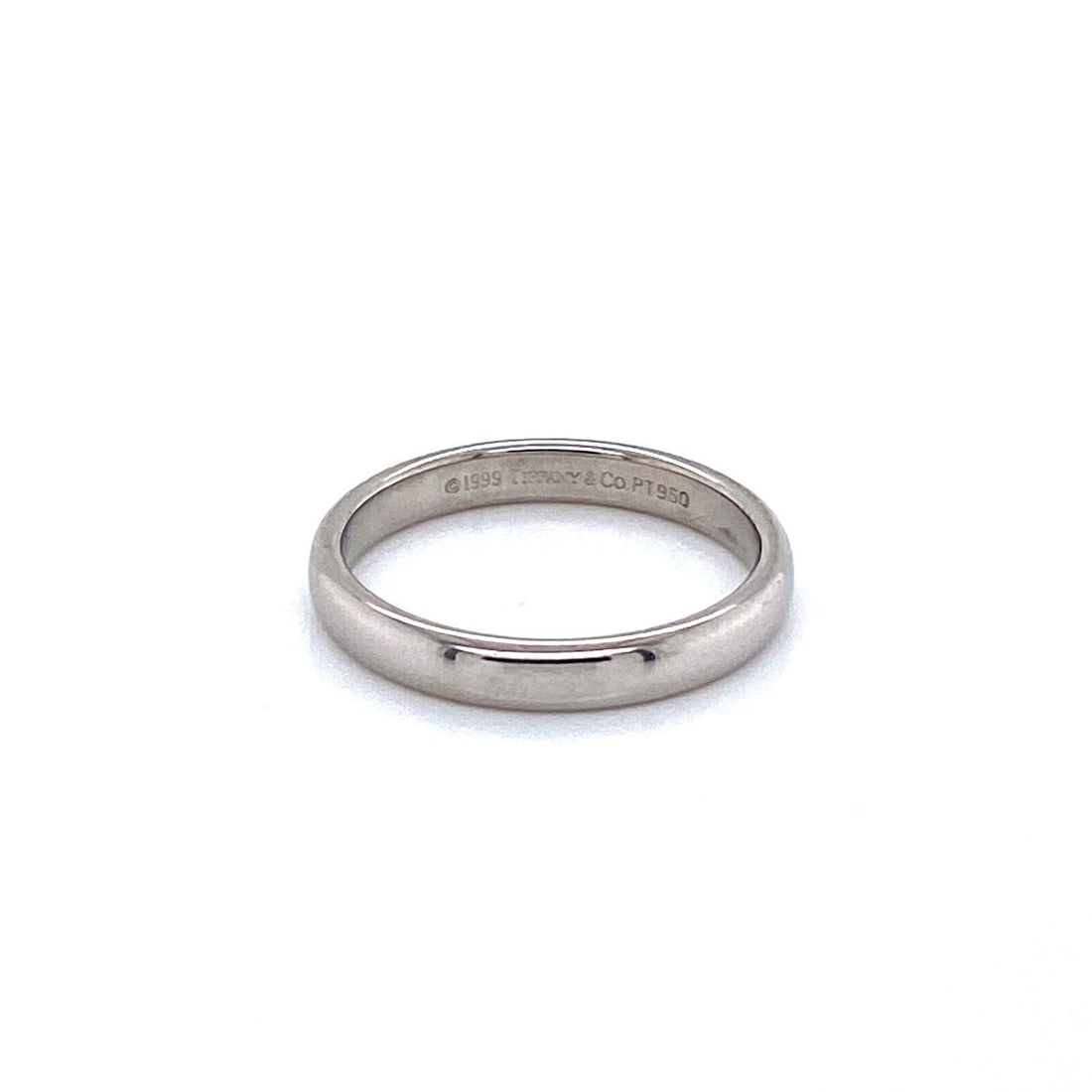Tiffany & Co. PT950 Platinum Band Ring Size 6.5: Tiffany & Co. PT950 Platinum Band Ring Size 6.5 This Tiffany & Co. platinum wedding band features a classic, polished design crafted from PT950 platinum. The ring offers a smooth, minimalist profile, 
