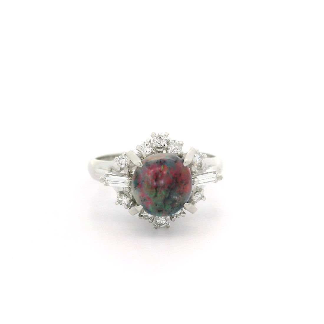 Platinum GIA Certified 1.30ctw Black Opal Diamond Cocktail Ring: Platinum GIA Certified 1.30ctw Black Opal Diamond Cocktail Ring This exquisite vintage cocktail ring features a stunning natural black opal set in solid platinum. The centerpiece is a prong-set caboch