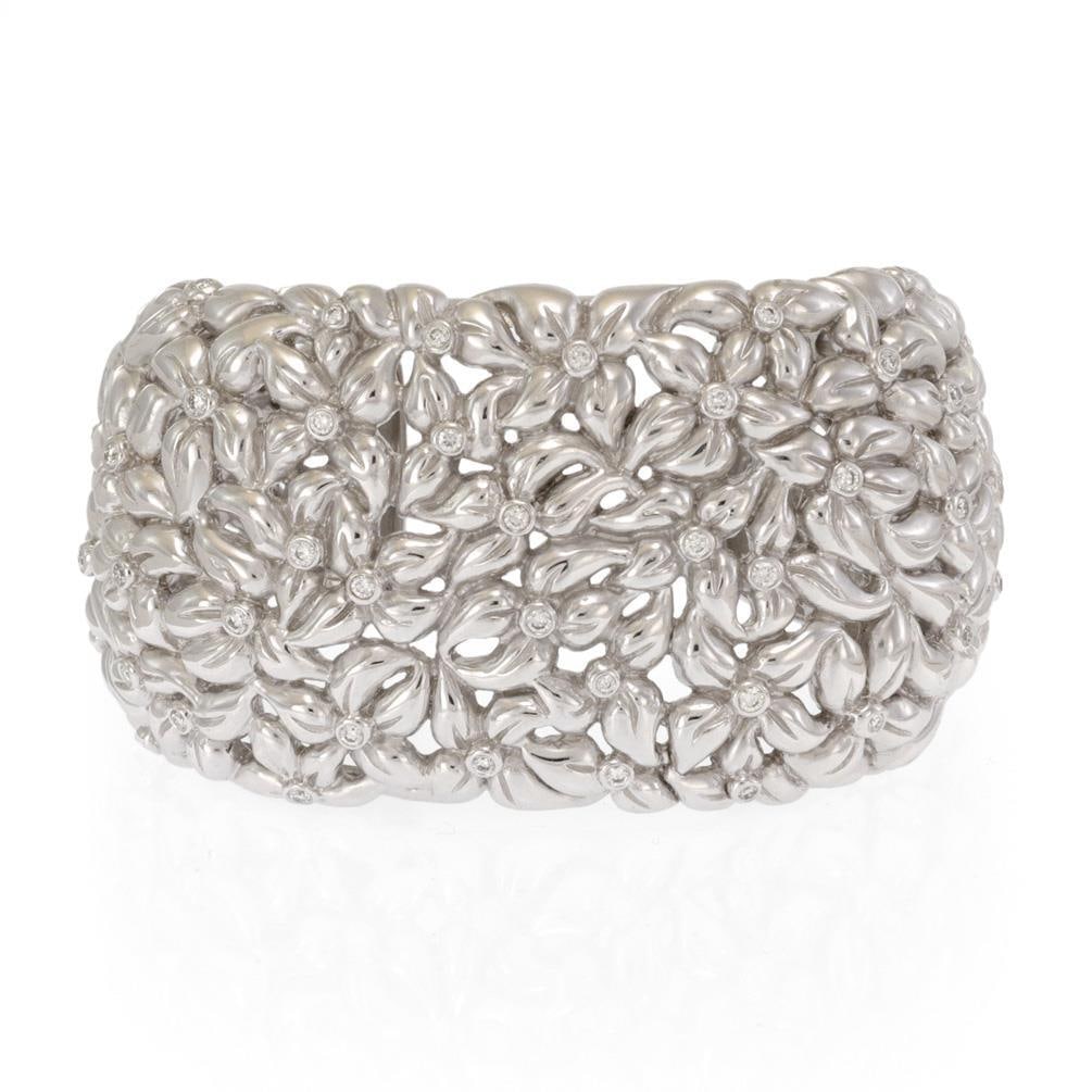 Stunning 1ct Diamond 18k White Gold Floral Cuff Bracelet 41mm Wide: Stunning 1ct Diamond 18k White Gold Floral Cuff Bracelet 41mm Wide This exquisite estate cuff bracelet showcases a stunning floral design, expertly crafted from 18k white gold. The bracelet features a