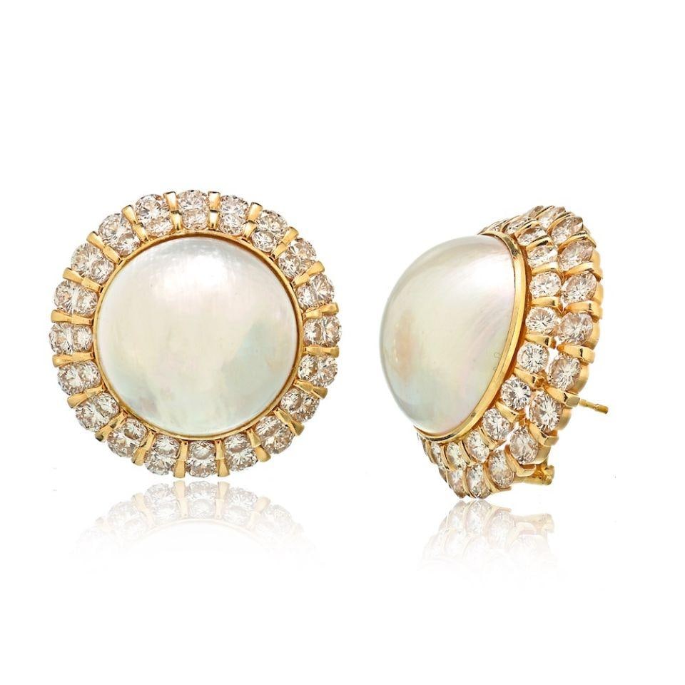 14K Yellow Gold Mabe Pearl Earrings with 8 Carats of Diamonds: 14K Yellow Gold Mabe Pearl Earrings with 8 Carats of Diamonds These exquisite 14K yellow gold earrings showcase a stunning round mabe pearl at the center, surrounded by sparkling round cut diamonds. W