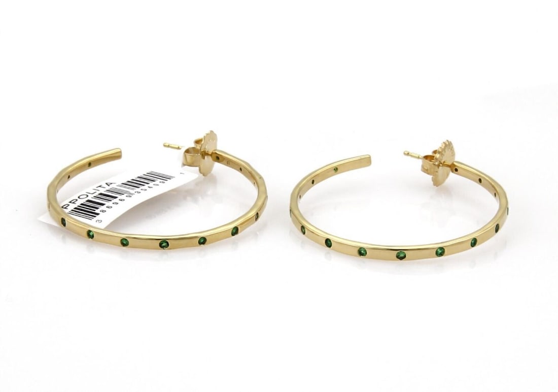 IPPOLITA Glamazon Stardust 18k Gold Tsavorite Hoop Earrings: IPPOLITA Glamazon Stardust 18k Gold Tsavorite Hoop Earrings These IPPOLITA Glamazon Stardust hoop earrings are crafted in 18k yellow gold and feature vibrant green tsavorite garnets. The earrings have