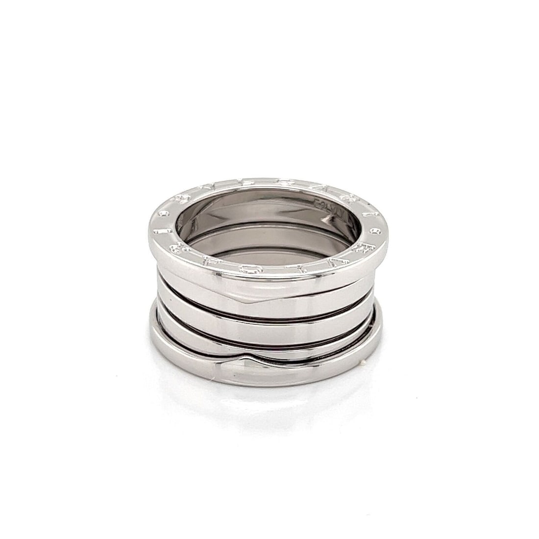 Bvlgari B.zero1 White Gold Wide Band Ring Size 6 Box Certificate: Bvlgari B.zero1 White Gold Wide Band Ring Size 6 Box Certificate This authentic Bvlgari B.zero1 Four-Band Ring is crafted from 18k white gold and features the iconic spiral-inspired design from the B.