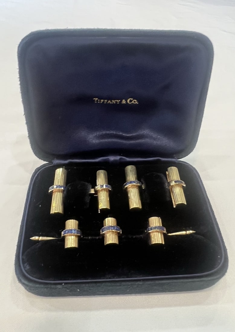 Tiffany Co 14k Yellow Gold Sapphire Cufflinks and Shirt Studs with Box: Tiffany Co 14k Yellow Gold Sapphire Cufflinks and Shirt Studs with Box This retro Tiffany & Co. dress set includes 14k yellow gold cufflinks and three shirt studs, each accented with blue sapphires. T