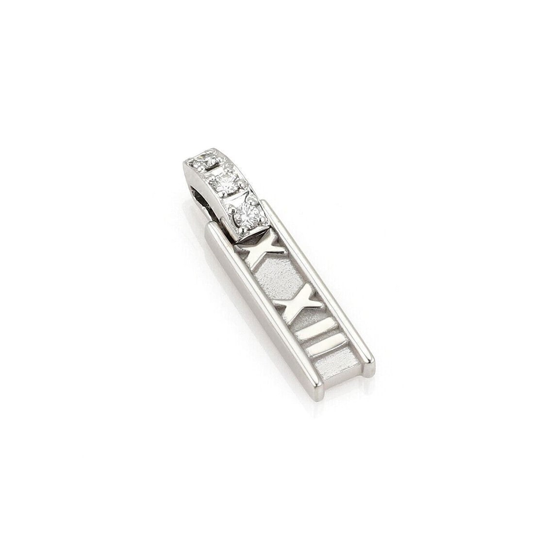Tiffany Atlas 18k White Gold Diamond Charm Pendant: Tiffany Atlas 18k White Gold Diamond Charm Pendant This authentic Tiffany & Co. Atlas bar charm pendant is crafted from 18k white gold and features the collection's signature Roman numeral design. Acc