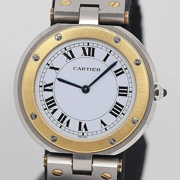 Cartier Santos Round Mens Quartz Watch Steel Yellow Gold White Dial: Cartier Santos Round Mens Quartz Watch Steel Yellow Gold White Dial This Cartier Santos Round wristwatch features a white dial and a combination of stainless steel and yellow gold construction. Design