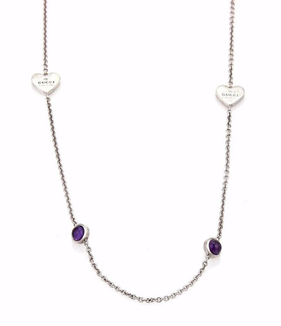 Gucci sterling silver amethyst beaded long necklace hearts dots: Gucci sterling silver amethyst beaded long necklace hearts dots This authentic Gucci long chain necklace is crafted from sterling silver and features the brand's signature hearts and dots motif. The n