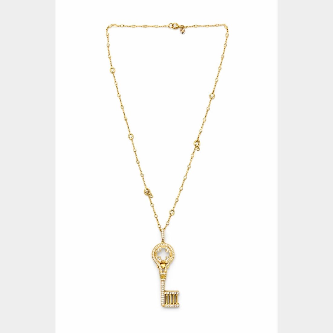 18K Gold Diamond Necklace with Key Pendant and Champagne Accents 19 Inch: 18K Gold Diamond Necklace with Key Pendant and Champagne Accents 19 Inch This VESCO necklace features a key pendant crafted in 18K yellow gold. The necklace is set with approximately 2.50 carats of di