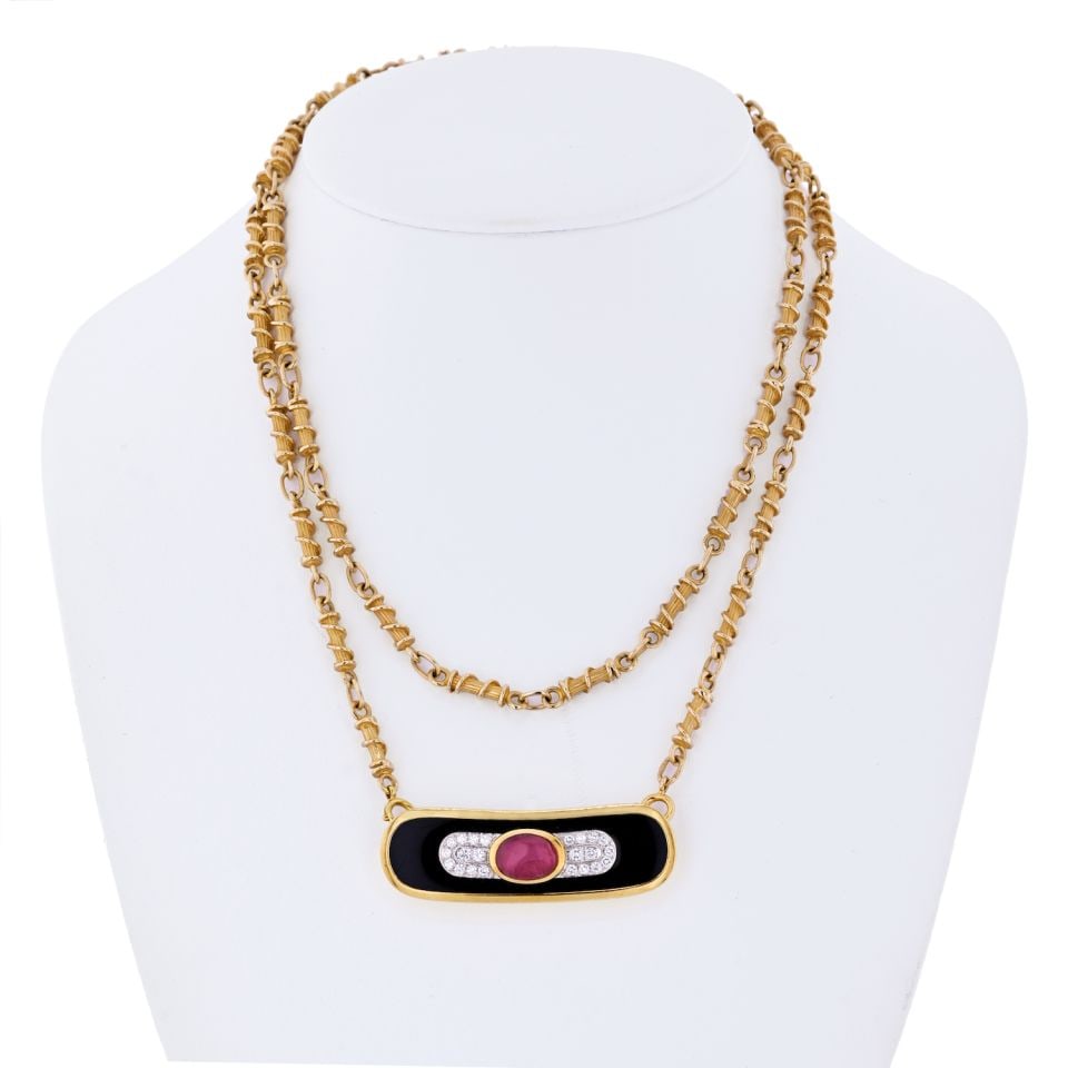 David Webb Ruby Diamond Pendant Necklace in Platinum and 18K Gold: David Webb Ruby Diamond Pendant Necklace in Platinum and 18K Gold This exquisite pendant necklace showcases the artistry of David Webb, featuring a stunning combination of platinum and 18K yellow gold