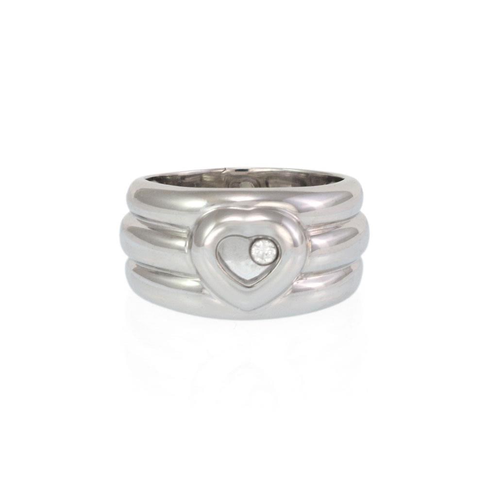 Chopard Happy Diamond 18k White Gold Heart Ring with Floating Diamond 7.75: Chopard Happy Diamond 18k White Gold Heart Ring with Floating Diamond 7.75 Discover elegance with this authentic wide band ring from Chopard's Happy Diamond collection. Crafted from luxurious 18k whit