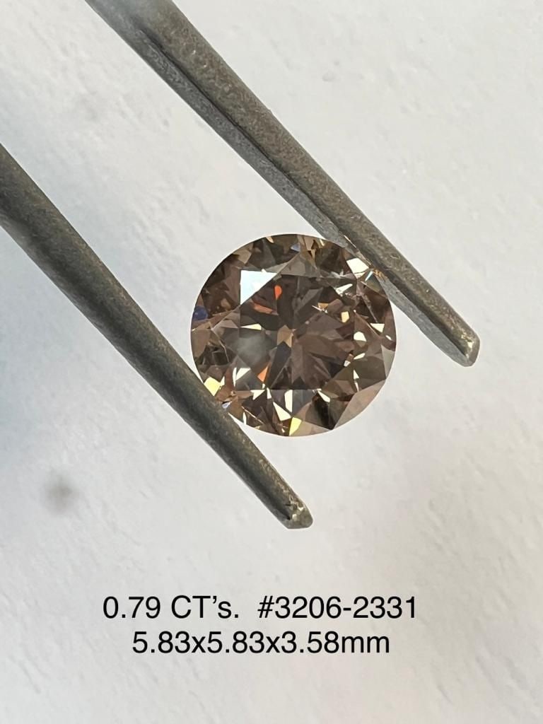 Loose Diamond - ROUND 0.79ct Brown SI2: Loose Diamond - ROUND 0.79ct Brown SI2 Source: Natural Shape: ROUND Carats: 0.79 Color: Brown Certification: NONE Video: