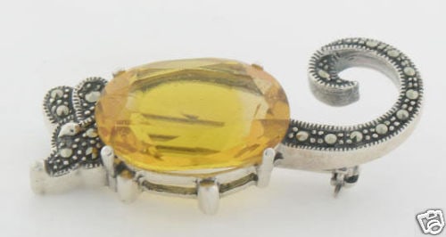 Unique Marcasite Sterling Silver Mouse Brooch with Yellow Topaz: Unique Marcasite Sterling Silver Mouse Brooch with Yellow Topaz This unique brooch features a charming mouse design crafted from .925 sterling silver, adorned with marcasite accents. The focal point i