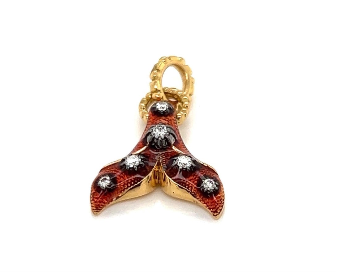 Gucci 18k Gold Fish Tail Diamond Charm Pendant: Gucci 18k Gold Fish Tail Diamond Charm Pendant This Gucci fish tail charm pendant is crafted in 18k yellow gold and features bronze-tone enamel detailing. The stylized fish tail design is accented wit