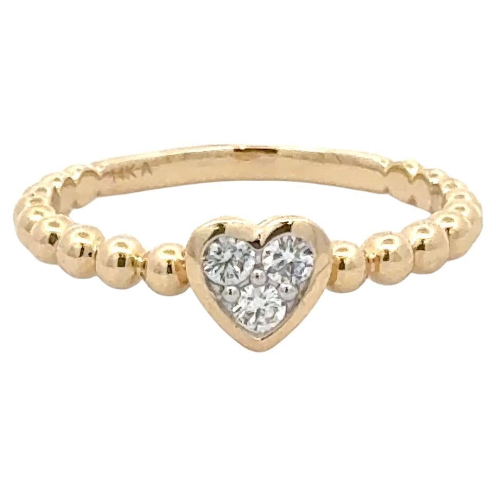 Harbor Diamonds 14K Yellow Gold Diamond Heart Bezel Ring 0.17 Carats: Harbor Diamonds 14K Yellow Gold Diamond Heart Bezel Ring 0.17 Carats This exquisite Diamond Heart Bezel Beaded Ring showcases three round brilliant diamonds totaling 0.17 carats, elegantly set in a co