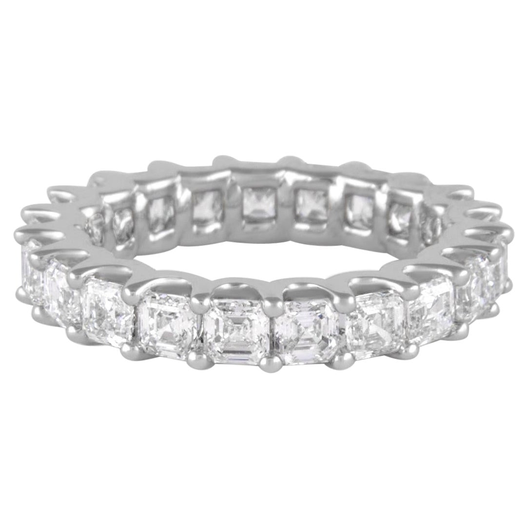 3.25ct Asscher Cut Diamond Eternity Ring 18k White Gold: 3.25ct Asscher Cut Diamond Eternity Ring 18k White Gold This stunning eternity band features 21 exquisite Asscher cut diamonds totaling 3.25 carats, boasting a D-F color range and VVS1 clarity. Crafte