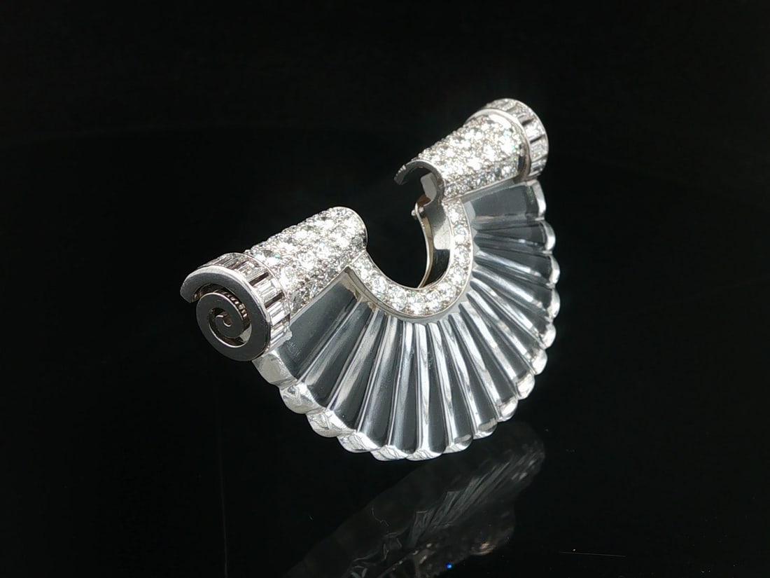 Suzanne Belperron Rock Crystal Diamond Platinum Fan Brooch: Suzanne Belperron Rock Crystal Diamond Platinum Fan Brooch This antique Art Deco brooch by Suzanne Belperron features a carved and fluted fan-shaped natural rock crystal accented by 64 natural diamond