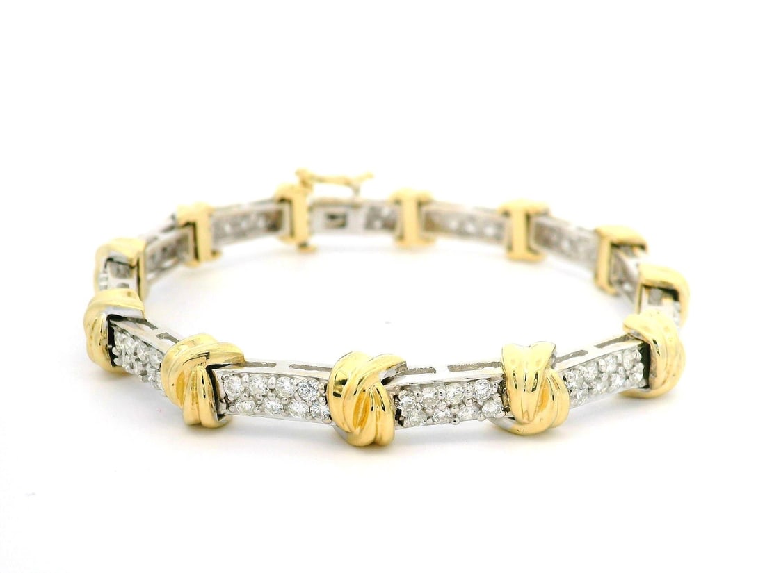 14k White Gold 2.50ctw Diamond Pave Bracelet with Yellow Gold Knot Links: 14k White Gold 2.50ctw Diamond Pave Bracelet with Yellow Gold Knot Links This exquisite bracelet features a stunning combination of solid 14k white gold and yellow gold knot links, showcasing a total 