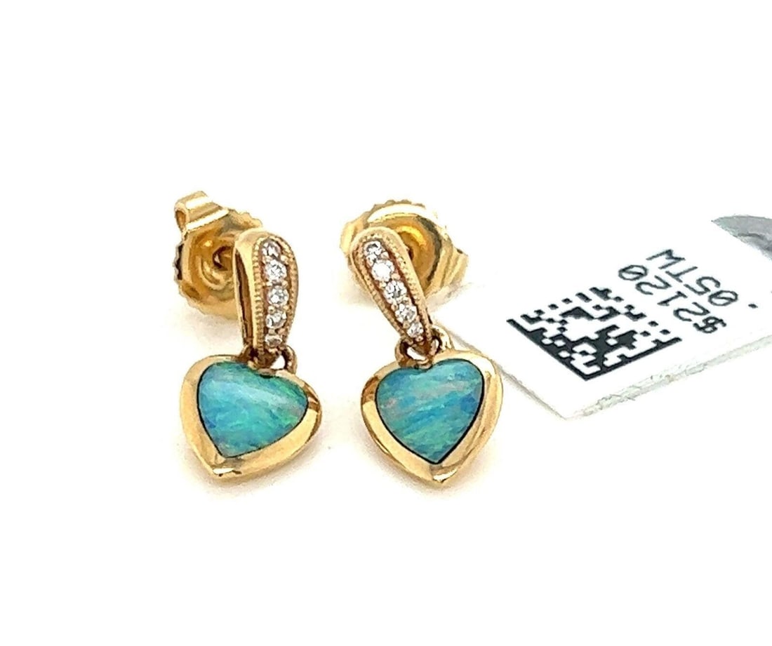 Kabana heart dangle earrings fire opal diamond 14k yellow gold: Kabana heart dangle earrings fire opal diamond 14k yellow gold These Kabana heart-shaped dangle earrings are crafted from 14k yellow gold and feature vibrant fire opal centers accented by sparkling di