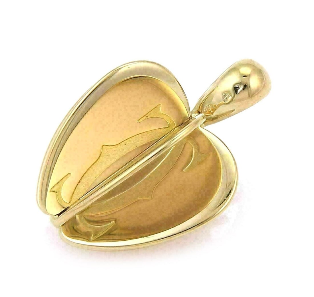 Cartier Apple Charm Pendant 18k Yellow Gold Double C: Cartier Apple Charm Pendant 18k Yellow Gold Double C This authentic vintage Cartier apple charm pendant is crafted in solid 18k yellow gold. Featuring a sculptural six-part construction, it is accente