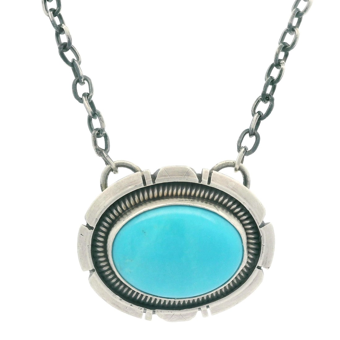 Wydell Billie Sterling Silver Turquoise Pendant Necklace 18.5 Inch: Wydell Billie Sterling Silver Turquoise Pendant Necklace 18.5 Inch This stunning Estate Wydell Billie necklace features a beautifully crafted oval pendant showcasing a natural genuine turquoise caboch