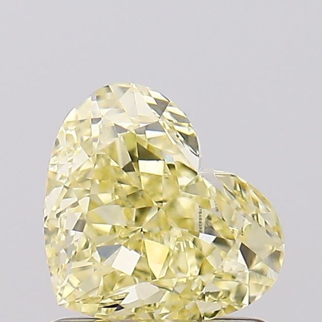 Loose Diamond - HEART 1.1ct Fancy Yellow VVS2: Loose Diamond - HEART 1.1ct Fancy Yellow VVS2 Source: This is a real non-mined Diamond that has been grown in a lab Shape: HEART Carats: 1.1 Color: Fancy Yellow Certification: IGI Video: