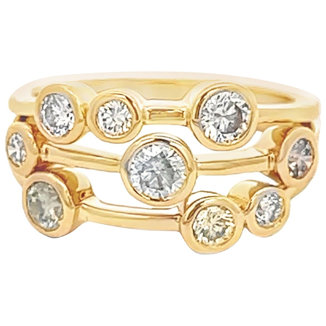 0.97ct Diamond Bezel Set Ring in 18k Yellow Gold: 0.97ct Diamond Bezel Set Ring in 18k Yellow Gold This exquisite 0.97ct Floating Diamond Bezel Set Ring is crafted in 18k Yellow Gold and features a stunning modern design. It showcases 9 round brillia