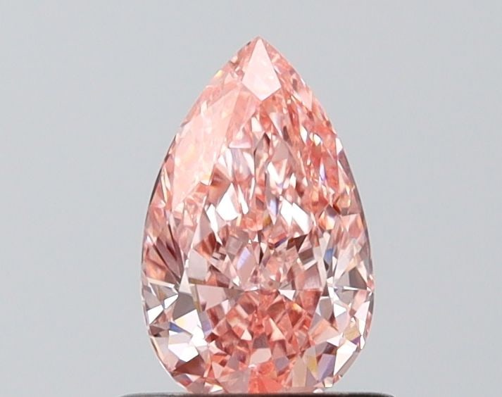 Loose Diamond - PEAR 0.81ct Fancy Vivid Pink VVS2: Loose Diamond - PEAR 0.81ct Fancy Vivid Pink VVS2 Source: This is a real non-mined Diamond that has been grown in a lab Shape: PEAR Carats: 0.81 Color: Fancy Vivid Pink Certification: IGI Video:
