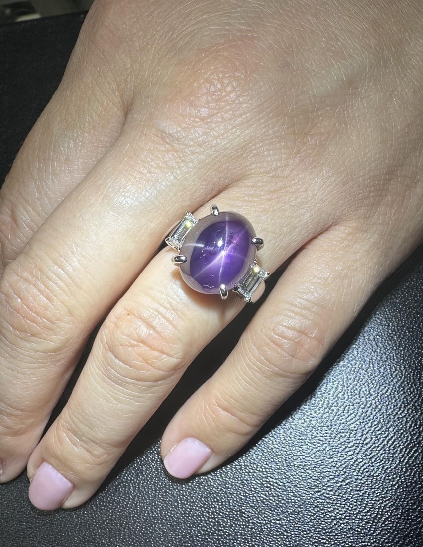 GIA Certified 15.68ct Vivid Purple Star Sapphire & Diamond Platinum Ring: GIA Certified 15.68ct Vivid Purple Star Sapphire & Diamond Platinum Ring This exquisite cocktail ring features a stunning natural vivid purple star sapphire, showcasing a captivating six-legged star e