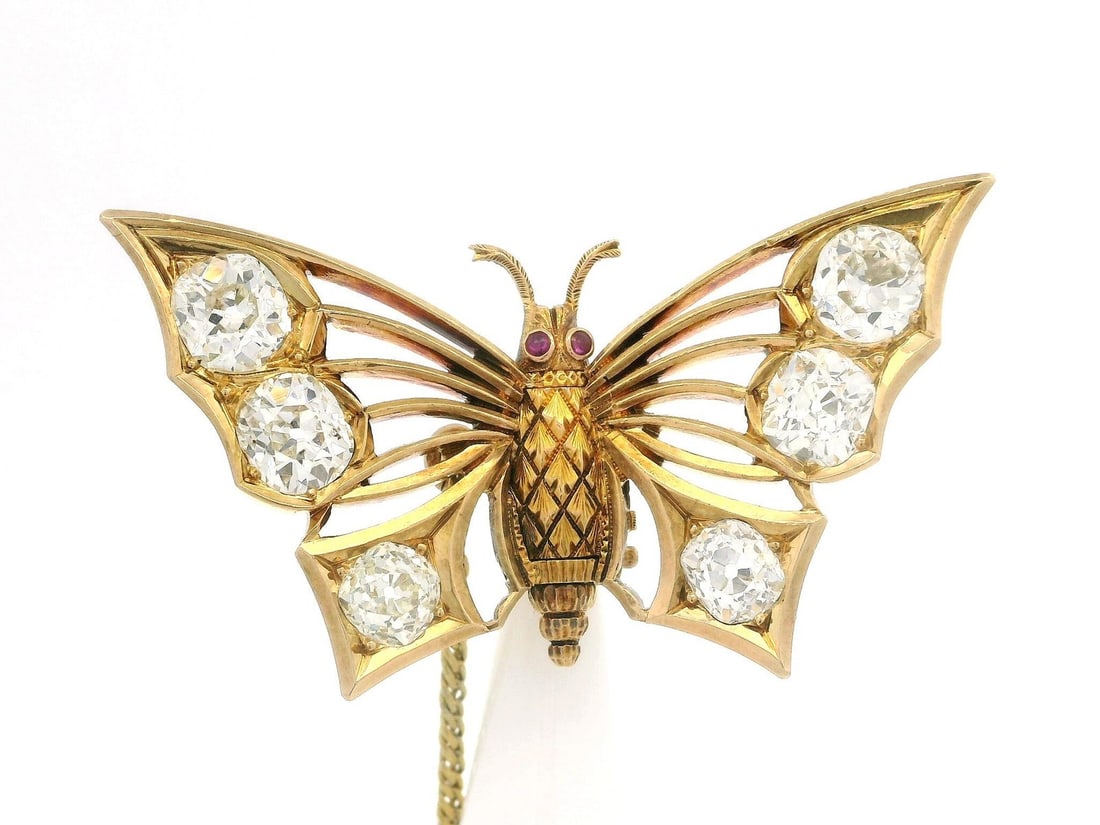 Antique Gold Butterfly Brooch 6.30ct Old Mine Cut Diamonds: Antique Gold Butterfly Brooch 6.30ct Old Mine Cut Diamonds This exquisite antique butterfly folding pin brooch features a stunning arrangement of natural old mine cut diamonds. The piece showcases (6)