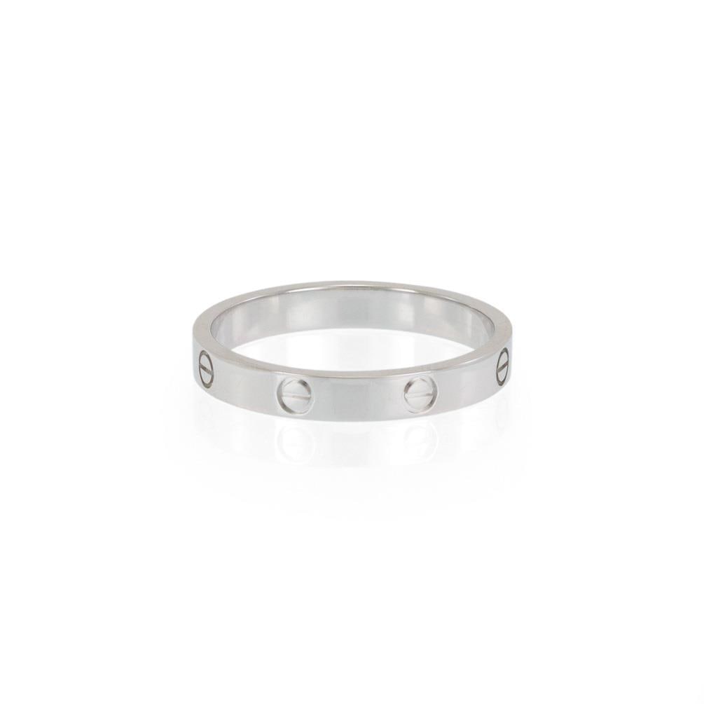 Cartier LOVE Collection 18k White Gold Band Ring Size 74: Cartier LOVE Collection 18k White Gold Band Ring Size 74 This exquisite authentic ring is crafted by Cartier from 18k white gold, featuring a fine polished finish. As part of the renowned LOVE Collect