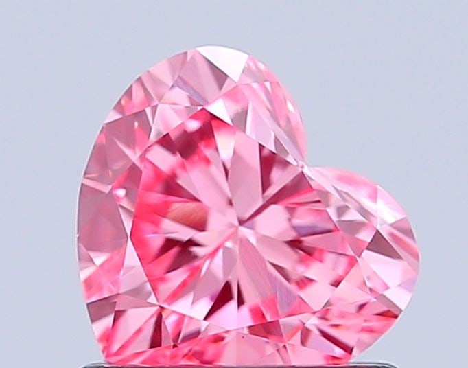 Loose Diamond - HEART 0.9ct Fancy Vivid Pink VS1: Loose Diamond - HEART 0.9ct Fancy Vivid Pink VS1 Source: This is a real non-mined Diamond that has been grown in a lab Shape: HEART Carats: 0.9 Color: Fancy Vivid Pink Certification: IGI Video: