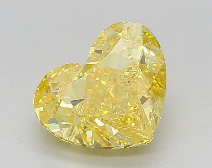 Loose Diamond - HEART 1.56ct Fancy Vivid Yellow VVS2: Loose Diamond - HEART 1.56ct Fancy Vivid Yellow VVS2 Source: This is a real non-mined Diamond that has been grown in a lab Shape: HEART Carats: 1.56 Color: Fancy Vivid Yellow Certification: IGI Video: