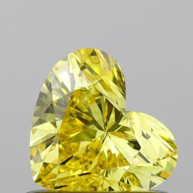 Loose Diamond - HEART 0.56ct Fancy Vivid Yellow SI1: Loose Diamond - HEART 0.56ct Fancy Vivid Yellow SI1 Source: This is a real non-mined Diamond that has been grown in a lab Shape: HEART Carats: 0.56 Color: Fancy Vivid Yellow Certification: IGI Video: