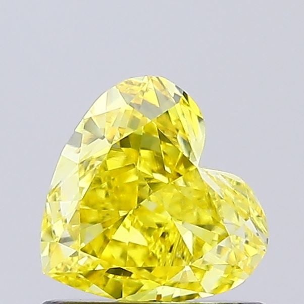 Loose Diamond - HEART 0.74ct Fancy Vivid Yellow VVS2: Loose Diamond - HEART 0.74ct Fancy Vivid Yellow VVS2 Source: This is a real non-mined Diamond that has been grown in a lab Shape: HEART Carats: 0.74 Color: Fancy Vivid Yellow Certification: NONE Video