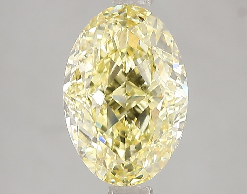 Loose Diamond - OVAL 3.06ct Fancy Vivid Yellow VS2: Loose Diamond - OVAL 3.06ct Fancy Vivid Yellow VS2 Source: This is a real non-mined Diamond that has been grown in a lab Shape: OVAL Carats: 3.06 Color: Fancy Vivid Yellow Certification: IGI Video: