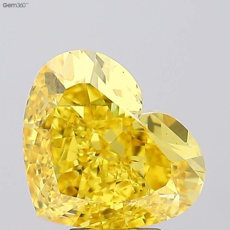 Loose Diamond - HEART 7.02ct Fancy Vivid Yellow VS1: Loose Diamond - HEART 7.02ct Fancy Vivid Yellow VS1 Source: This is a real non-mined Diamond that has been grown in a lab Shape: HEART Carats: 7.02 Color: Fancy Vivid Yellow Certification: IGI Video: