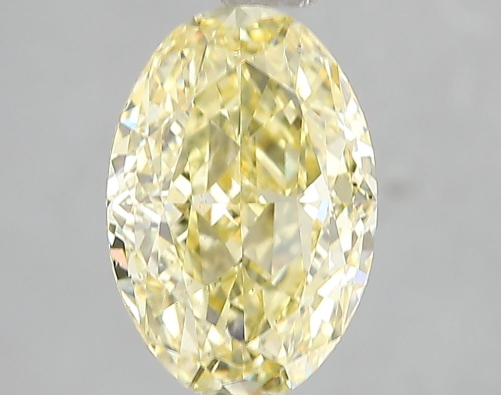 Loose Diamond - OVAL 3.03ct Fancy Vivid Yellow VS2: Loose Diamond - OVAL 3.03ct Fancy Vivid Yellow VS2 Source: This is a real non-mined Diamond that has been grown in a lab Shape: OVAL Carats: 3.03 Color: Fancy Vivid Yellow Certification: IGI Video: