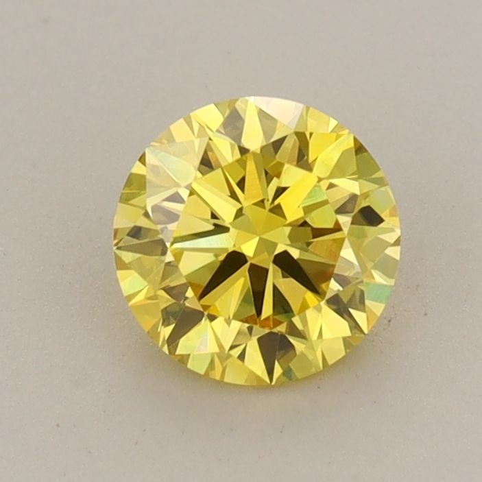 Loose Diamond - ROUND 0.72ct Fancy Vivid Yellow VVS2: Loose Diamond - ROUND 0.72ct Fancy Vivid Yellow VVS2 Source: This is a real non-mined Diamond that has been grown in a lab Shape: ROUND Carats: 0.72 Color: Fancy Vivid Yellow Certification: IGI The Di