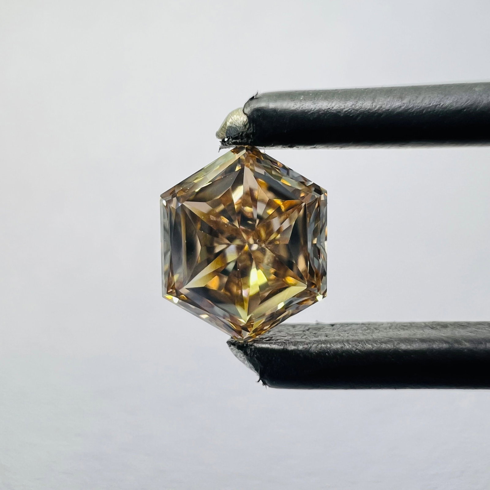 Loose Diamond - HEXAGONAL 0.52ct Orange VVS2: Loose Diamond - HEXAGONAL 0.52ct Orange VVS2 Source: This is a real non-mined Diamond that has been grown in a lab Shape: HEXAGONAL Carats: 0.52 Color: Orange Certification: NONE The Diamond Depot Gua