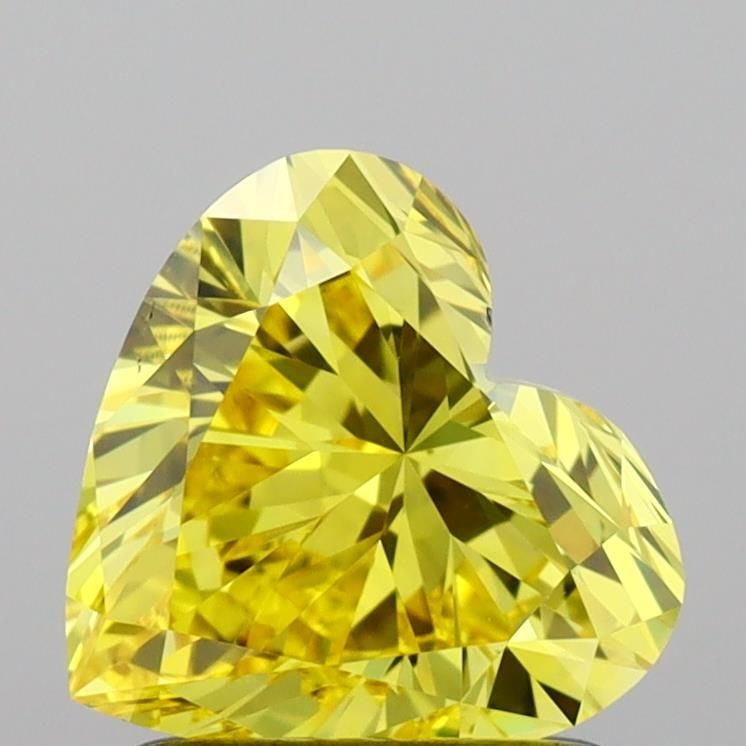 Loose Diamond - HEART 1.23ct Fancy Vivid Yellow VS1: Loose Diamond - HEART 1.23ct Fancy Vivid Yellow VS1 Source: This is a real non-mined Diamond that has been grown in a lab Shape: HEART Carats: 1.23 Color: Fancy Vivid Yellow Certification: IGI Video: