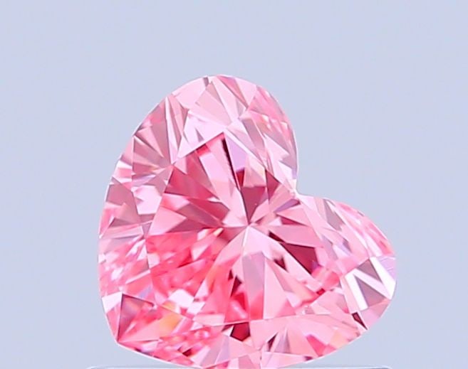 Loose Diamond - HEART 0.63ct Fancy Vivid Pink VVS2: Loose Diamond - HEART 0.63ct Fancy Vivid Pink VVS2 Source: This is a real non-mined Diamond that has been grown in a lab Shape: HEART Carats: 0.63 Color: Fancy Vivid Pink Certification: IGI Video: